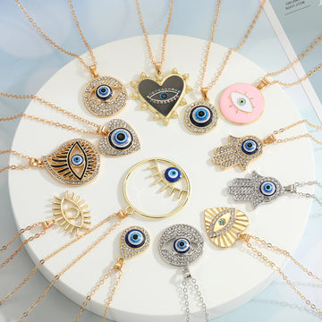 Crystal Evil Eye and Hamsa Pendant Necklaces in Twelve Designs