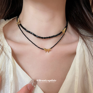 Black Beaded Double Strand Necklace With Gold Butterflies