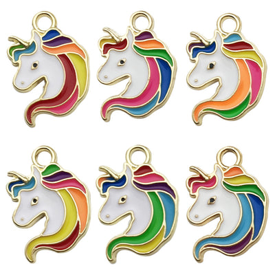 Colorful cake charms arranged on a light background