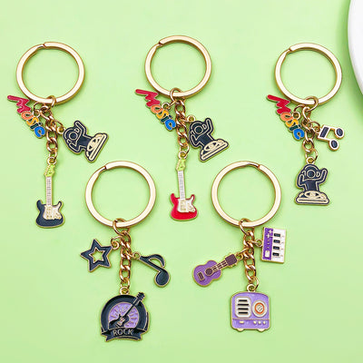 Image 1 showing a bunch of different key chains on top of a green surface.