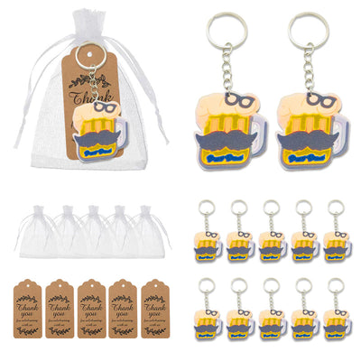 A packaged beer mug keychain is displayed beside loose keychains, white organza bags, and printed thank-you tags.