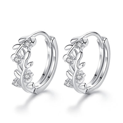 Front product view of silver tone leaf vine hoop earrings with clear stone accents