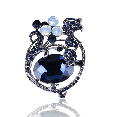Blue Tulip, Red Tulip brooch styles arranged on a light display