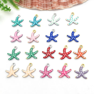 Gold-tone starfish charms arranged on a light background