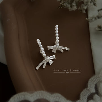 Silver Pearl C-Curve Earrings with Crystal Pave Bow Accents