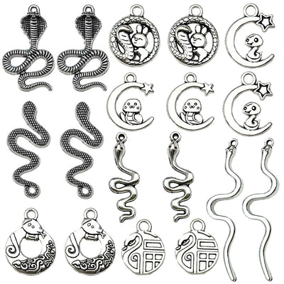Metallic assorted shape charms arranged on a light background