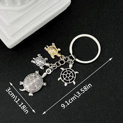Main display of silver tone turtle family and starfish keychain