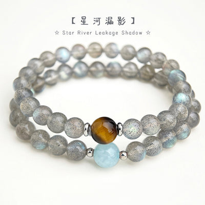 Gray labradorite bead bracelets with stone focals on display surface