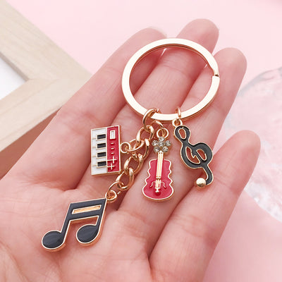 Image 1 showing a person holding up some musical items.