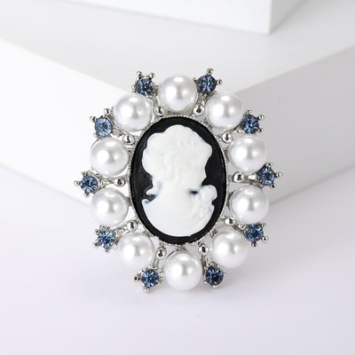 Silver pearl cameo lady head brooch front on white blocks