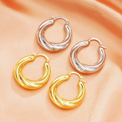Front product view of the Silver Tone and Gold Tone earring design showing rounded hoops with sculpted parallel ridges a