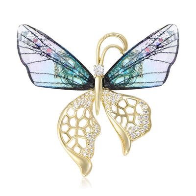 Two colorways of translucent openwork butterfly brooch shown side by side.
