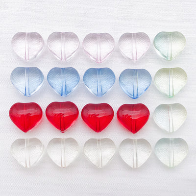 Clear heart charms arranged on a light background