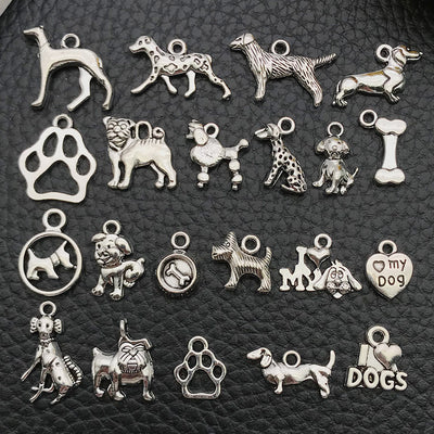 Antique silver assorted shape charms arranged on a light background