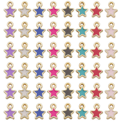 Gold-tone star charms arranged on a light background