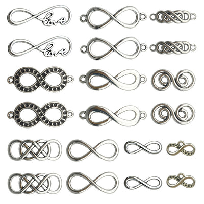 Antique silver connector clasp jewelry findings arranged on a light background