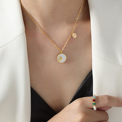 Gold shell flower disc necklace worn on collarbone
