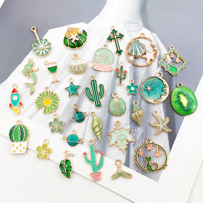 Colorful mermaid charms arranged on a light background
