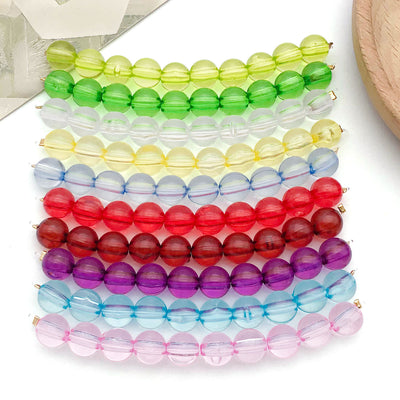 Clear spacer bead beads arranged on a light background