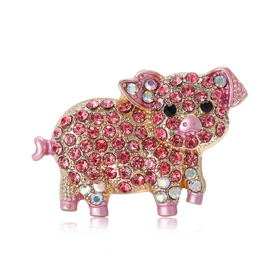 Front view of the pink crystal pig brooch showing a pink crystal-covered pig with black eyes and tiny blue hooves