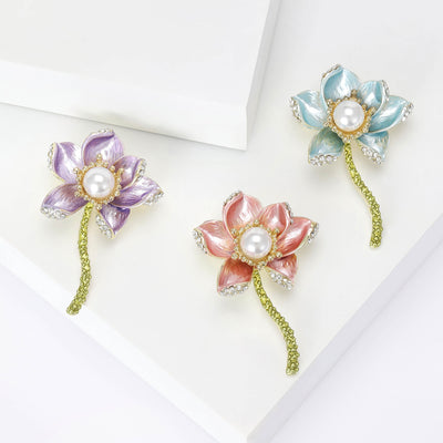 Front view showing the enamel lotus brooch with faux pearl center and curved stem