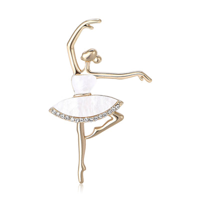 Front view of gold tone ballerina with a white skirt and clear crystal trim