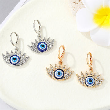 Crystal Lash Blue Evil Eye Huggie Earrings in Gold and Silver Tone