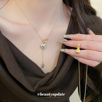 Gold Tone Heart Lock Pendant Necklace with Small Crystal Accents