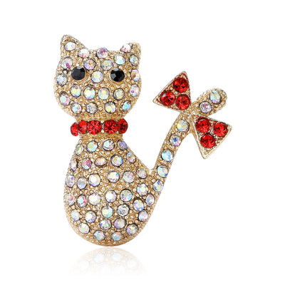 Gold Cat, Silver Cat brooch styles arranged on a light display