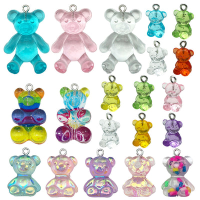 Iridescent bear charms arranged on a light background