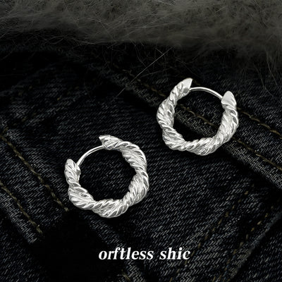 Silver-tone textured-leaf wreath round hoops in the first product display.