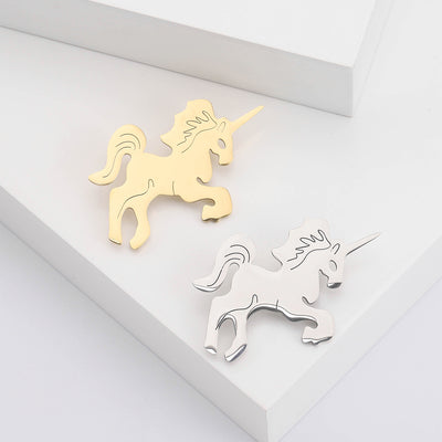 Minimal Unicorn Brooch in Gold and Silver Tones displayed from the front