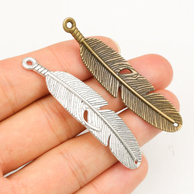 Feather Charms arranged in the pictured color and finish options