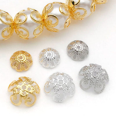 Front overview of dotted bowl and open flower metal bead caps arranged by finish and size