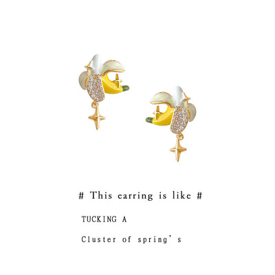 Gold-tone yellow-banana white-peel clear-stone studs in the first product display.
