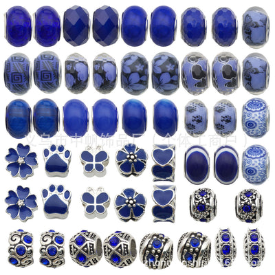 Blue bead beads arranged on a light background