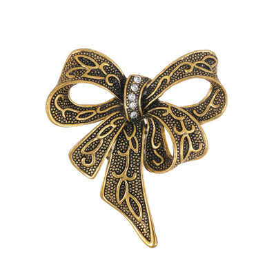 Front product view of an antique bow brooch