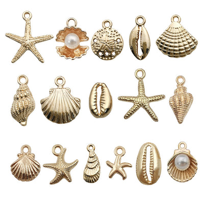 Gold-tone starfish and seashell charms arranged on a light background