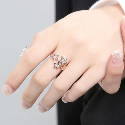 Rose gold multi star pave open ring worn on hand fingers