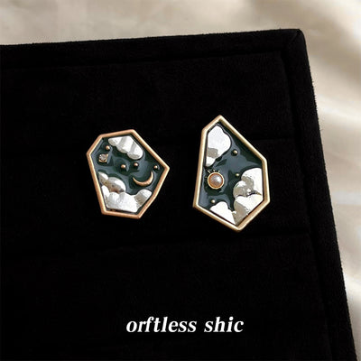 Dark green pentagon moon sun asymmetric studs on black card