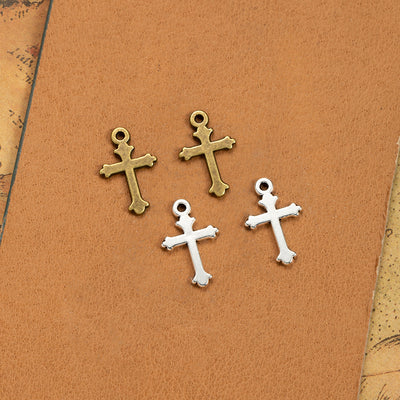 Simple cross charm components displayed in multiple metal finishes