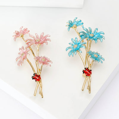 Enamel Daisy Bouquet Brooch shown against a white display background