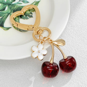 Resin Cherry Pair Charm Keychain with Gold Tone Hardware Accents