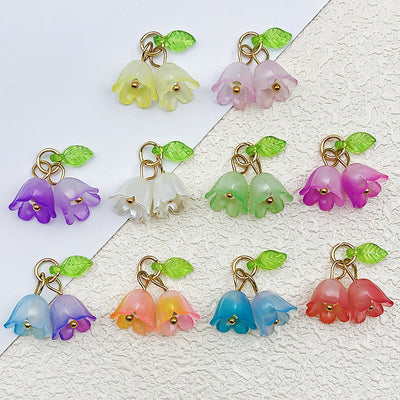 Colorful flower charms arranged on a light background