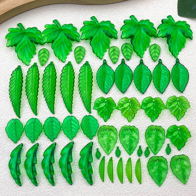Clear leaf beads arranged on a light background