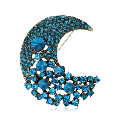Front view of a crescent moon densely set with graduated faceted crystals