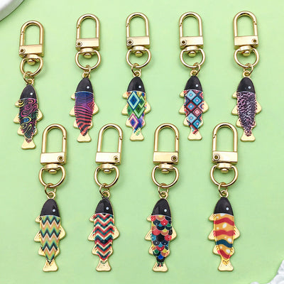 Image 1 showing a bunch of different colored fish shaped key chains.
