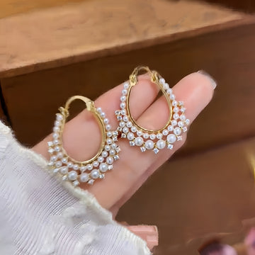 Gold Tone Twisted Hoop Earrings With Crystal Pearl Rows
