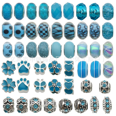 Blue bead beads arranged on a light background