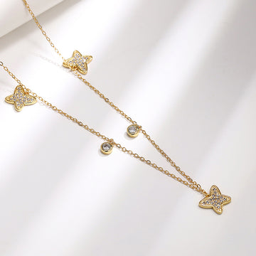 Gold Tone Star and Butterfly Station Necklace with Clear Stones